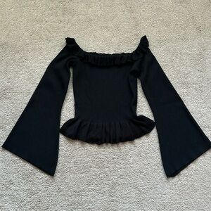 Black off-shoulder top.